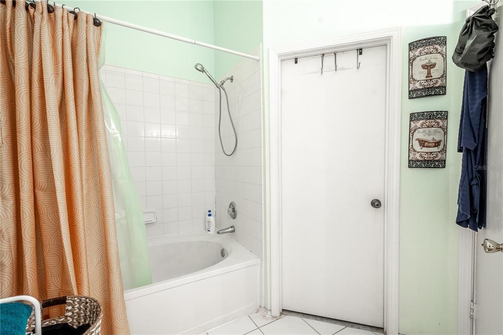 2nd floor bathroom, door leads out to hallway and into primary bedroom.