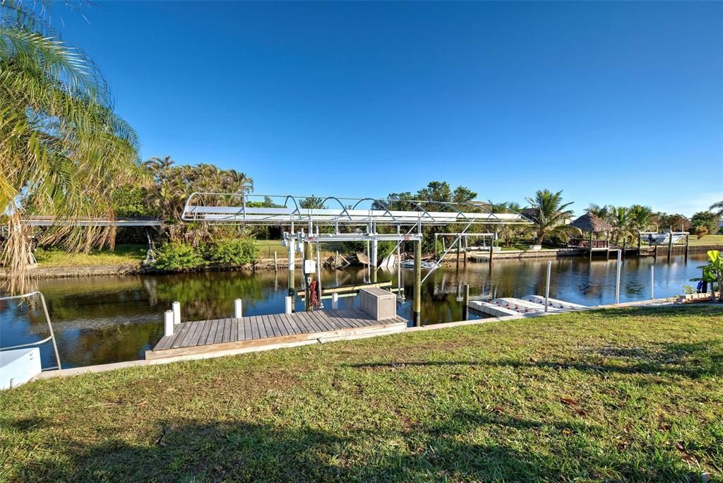 10,000 lb boat lift, 2 floating jet ski docks and kayak lift.