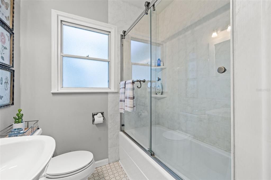 Updated Bathroom with glass shower enclosure