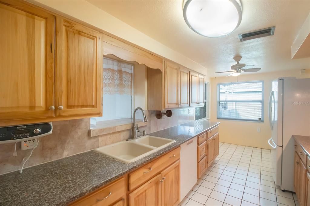 Kitchen has Pass-thought to Family Room