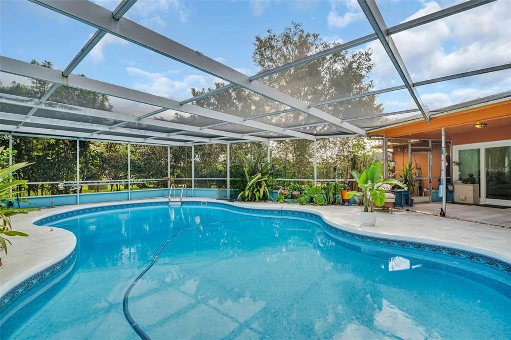 Covered porch patio along side the pool to enjoy year-round~