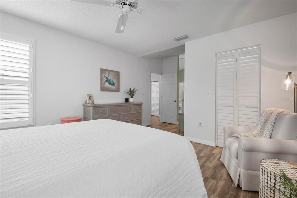 Primary bedroom with ensuite bath and walk in closet