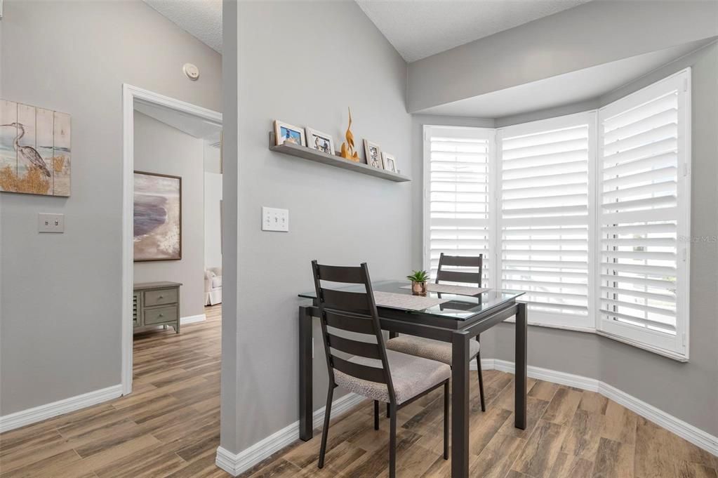 Breakfast nook in kitchen with bay window into the courtyard