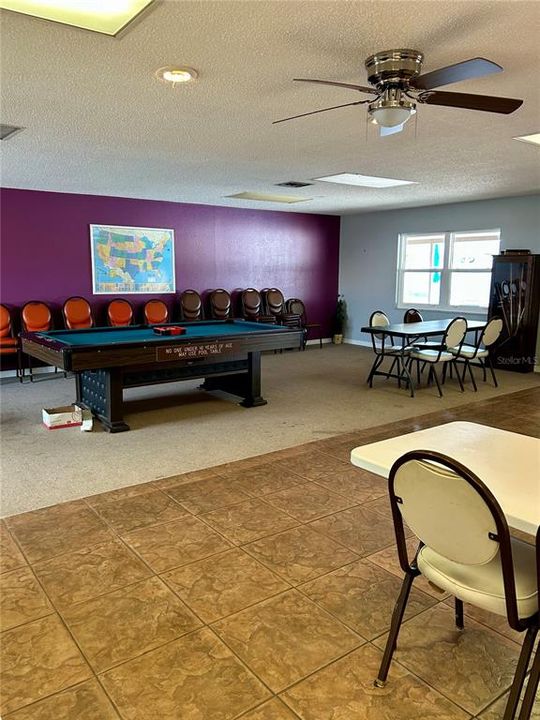 Community Club house with pool table and library area