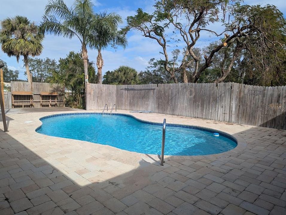 Pool deck with privacy fence