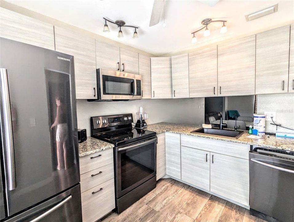 There is plenty of food prep room on these granite counter tops.