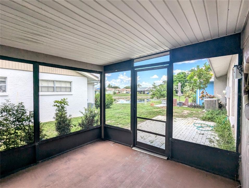 Screened in patio looking out to the pond.