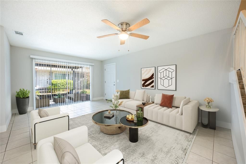 Light & bright living area has sliding glass door access to a large screened lanai. Virtually Staged.