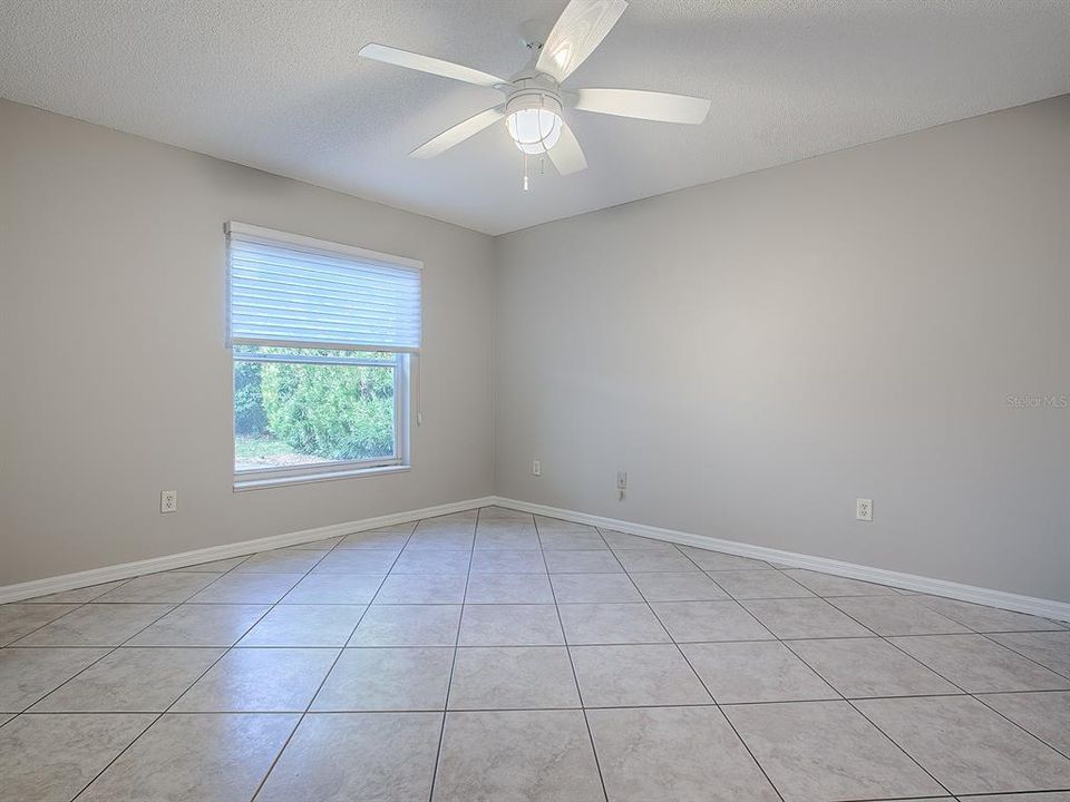 PRIMARY BEDROOM WITH BLINDS OPEN