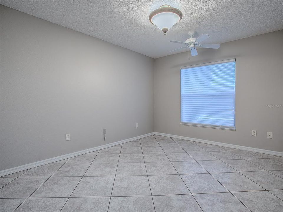 REAR GUEST BEDROOM WITH WINDOW FACING THE PRESERVE