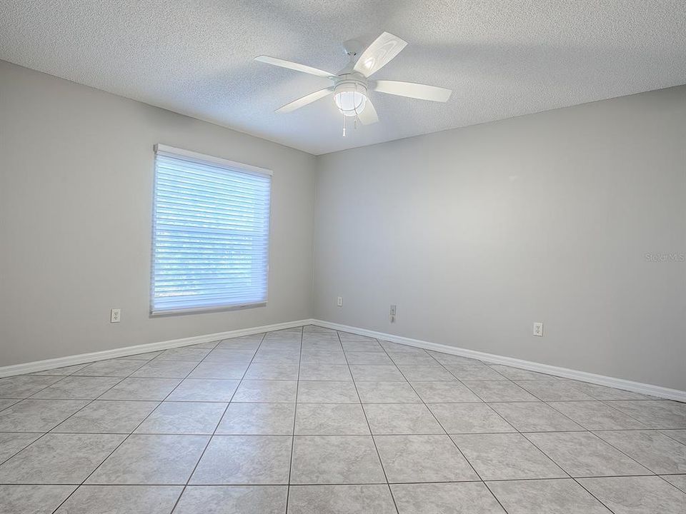 PRIMARY BEDROOM WITH BLINDS CLOSED