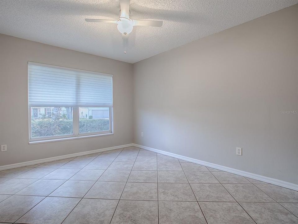 FRONT GUEST BEDROOM WITH DOUBLE WIDE WINDOW & CERAMIC TILE FLOORING