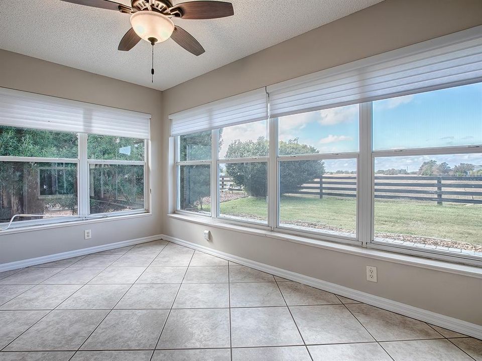 FABULOUS FLORIDA ROOM WITH VIEW OF BACKYARD & WILDLIFE PRESERVE JUST BEYOND