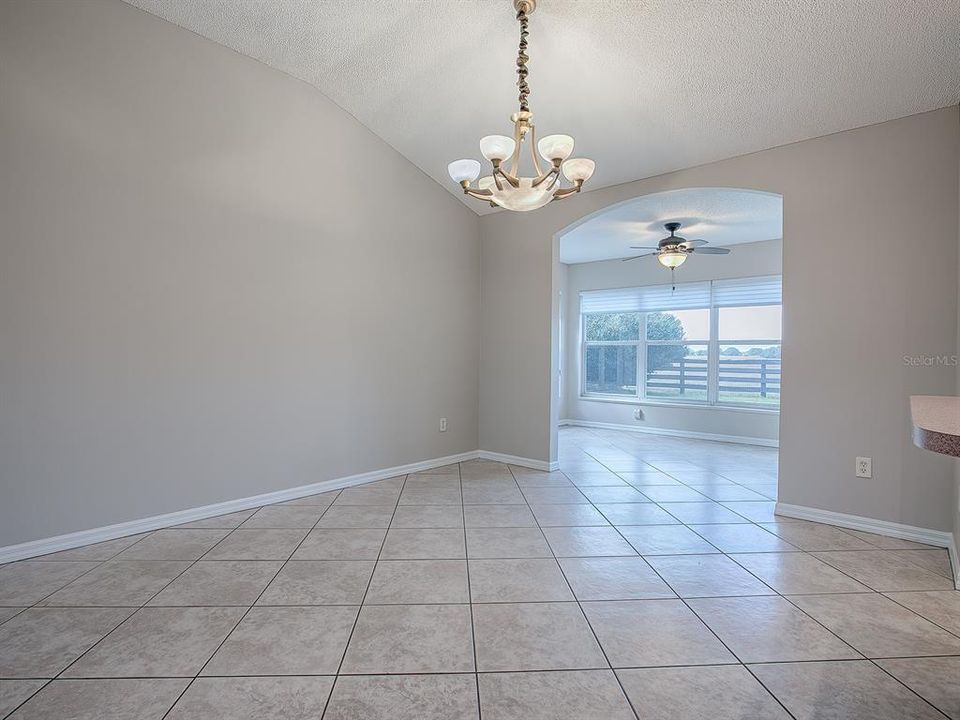 DINING ROOM WITH FLORIDA ROOM IN BACKGROUND