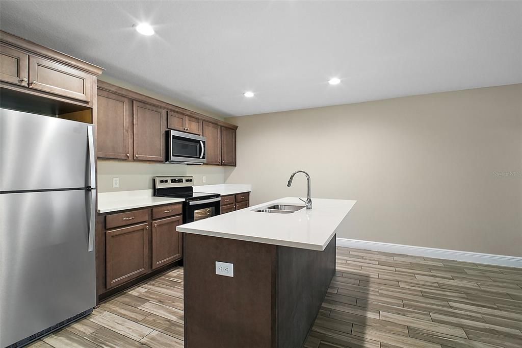 Stainless Steel Appliances and Quartz Countertops.