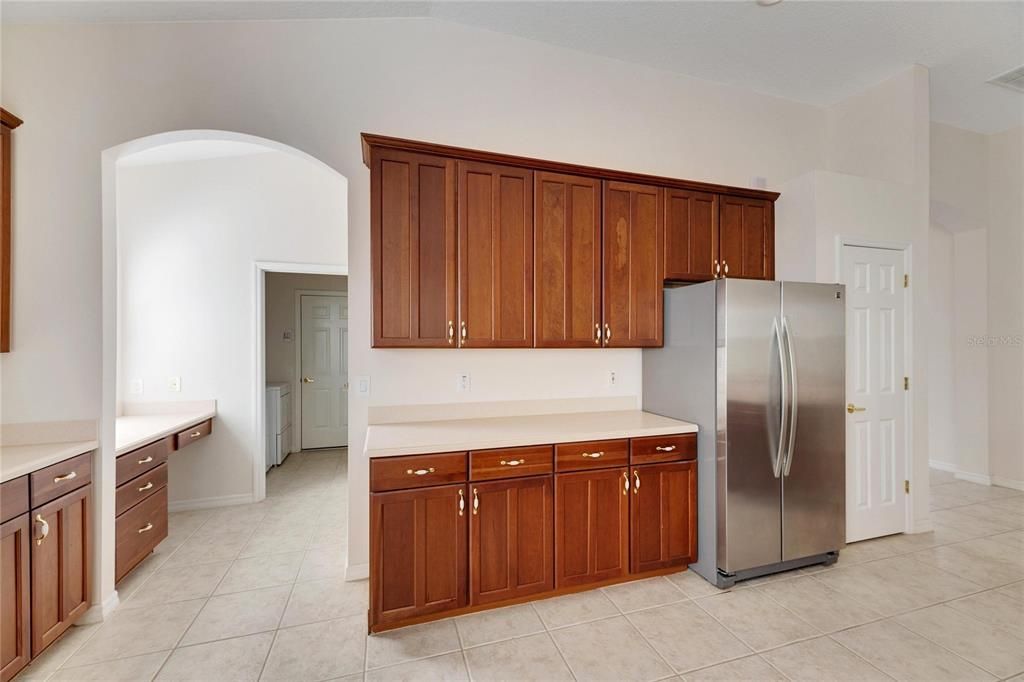 Center left is the built in desk/ work station leading to laundry room, and two car garage.