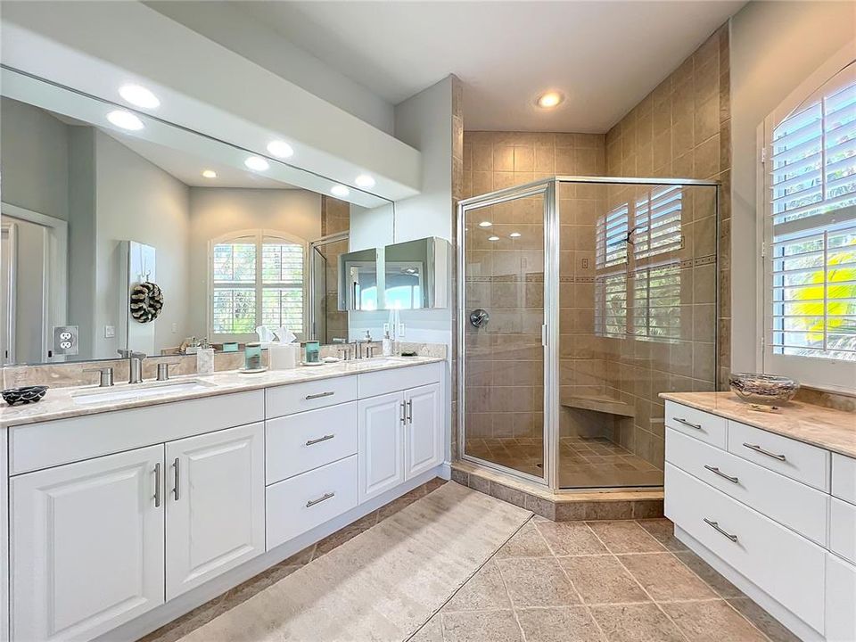 Primary Master Bathrooom with walk-in Shower, double vanities and separate water closet