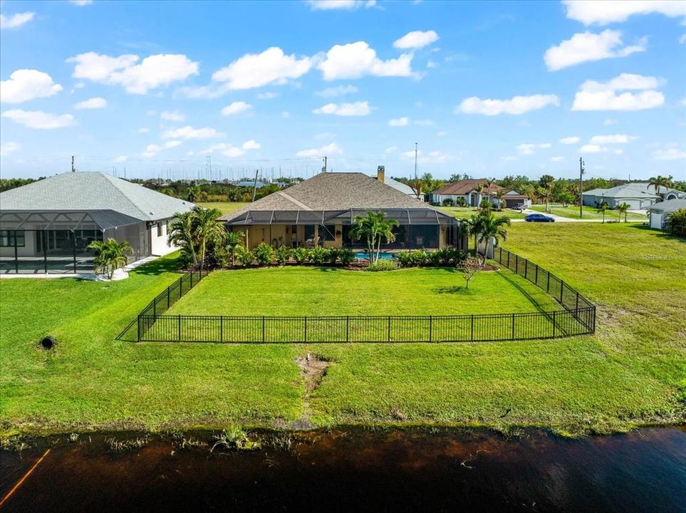 Fenced Yard Perfect for Pets, with Serene Canal Views Ideal for Nature Lovers