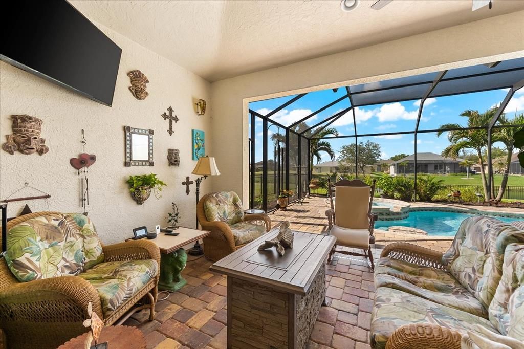 Sliding Glass Doors Lead Directly to Serene Outdoor Seating by the Pool