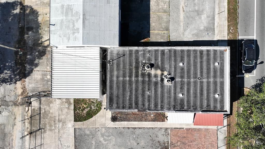 Aerial of office building and the rear metal building