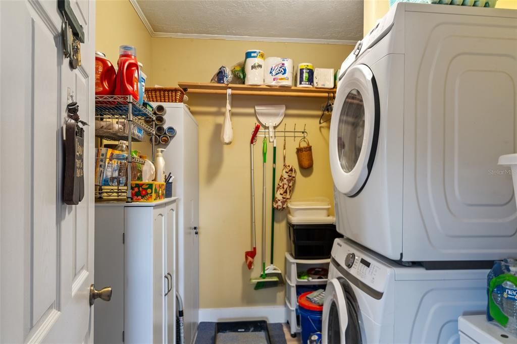 Laundry Room with storage and front load washer/dryer