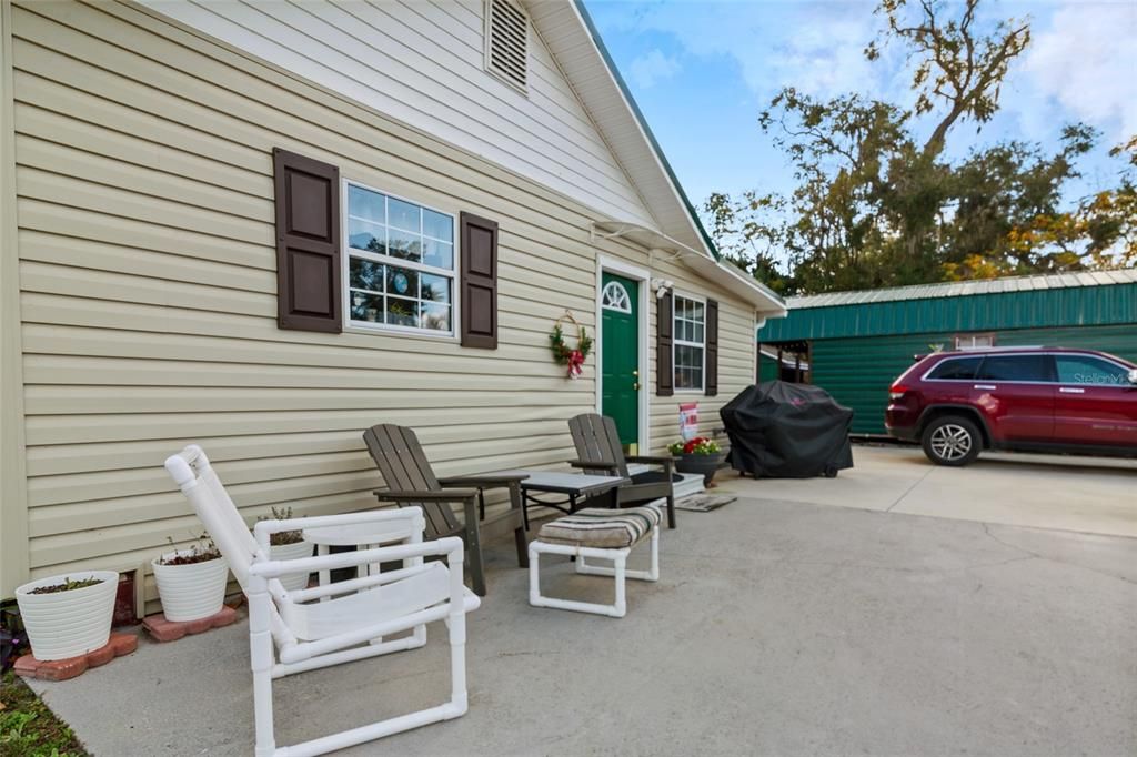 Large concrete pad extends for parking with circular drive