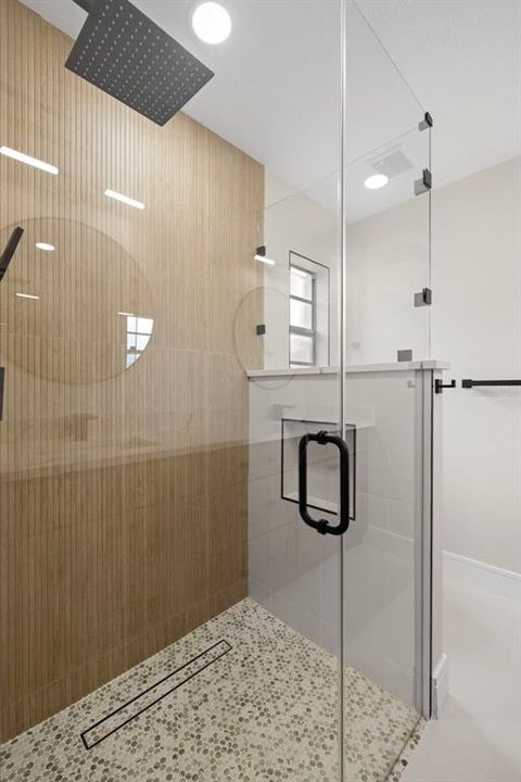 The Curbless entry into the Master Shower is an upgrade most people won't spend the money to get it completed!  No more of a trip hazard! More importantly the high-end skilled Tile Contractors are hard to find!  The slope of the shower floor has to be perfect! And it is Perfect!