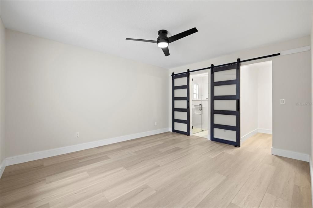 Master Bedroom! Frosted Glass Barn Doors accent the Master Bathroom and Master Closet!