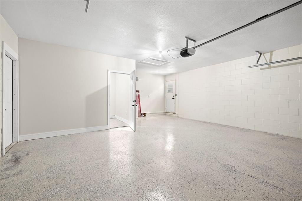 Garage with Service door to the outside and you see the Dedicated Laundry Room