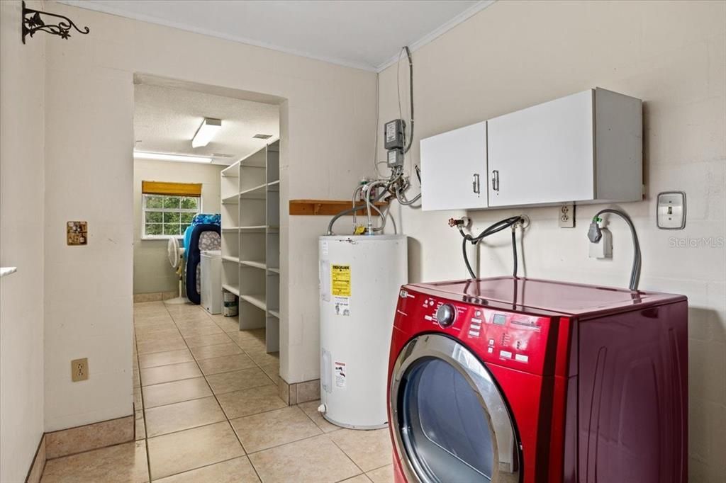 laundry/storage room off kitchen and garage