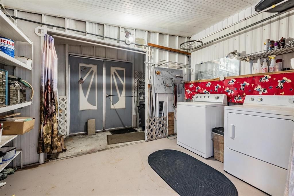 Large laundry with utility behind.  Can also be golf cart storage.