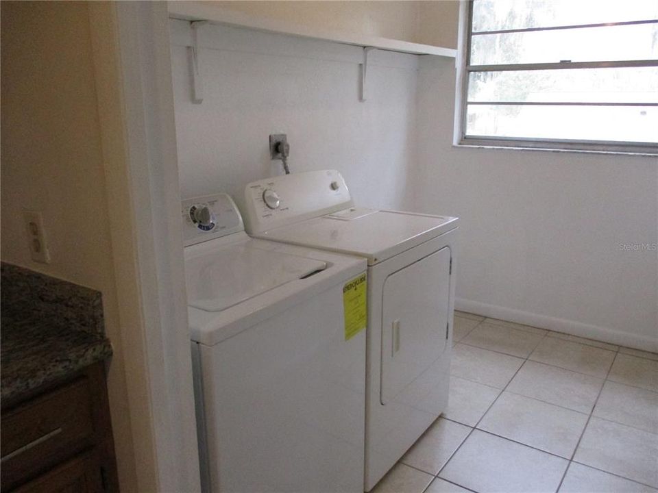 Laundry room with washer and dryer included