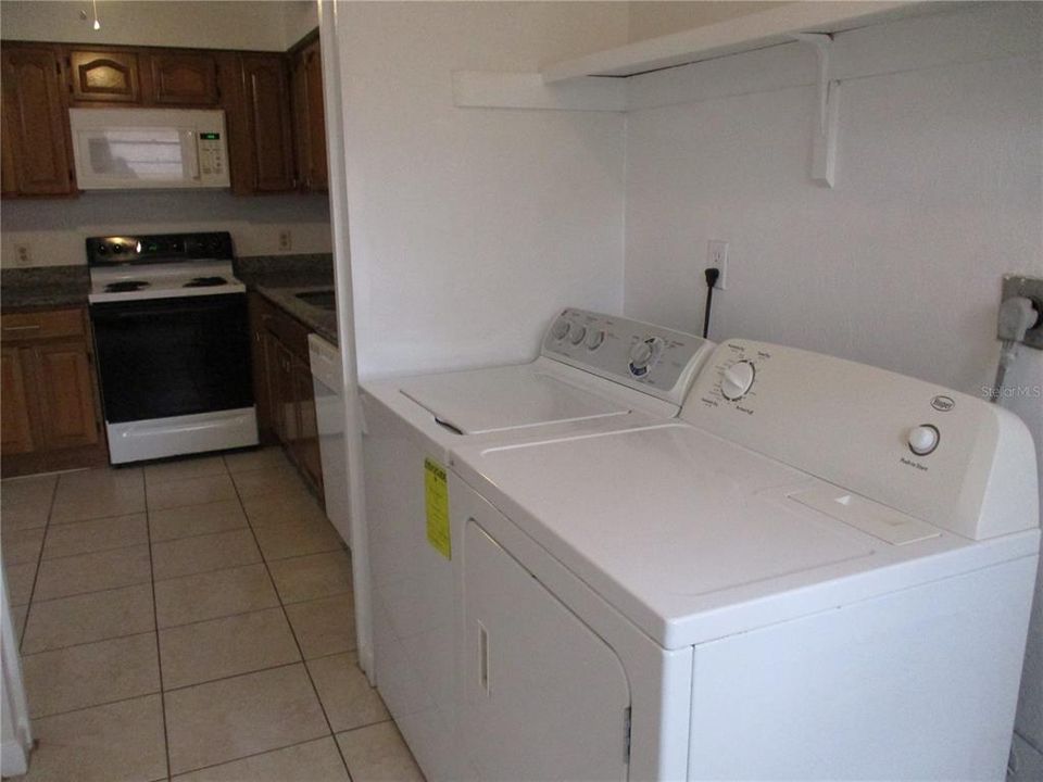 Laundry room adjacent to kitchen