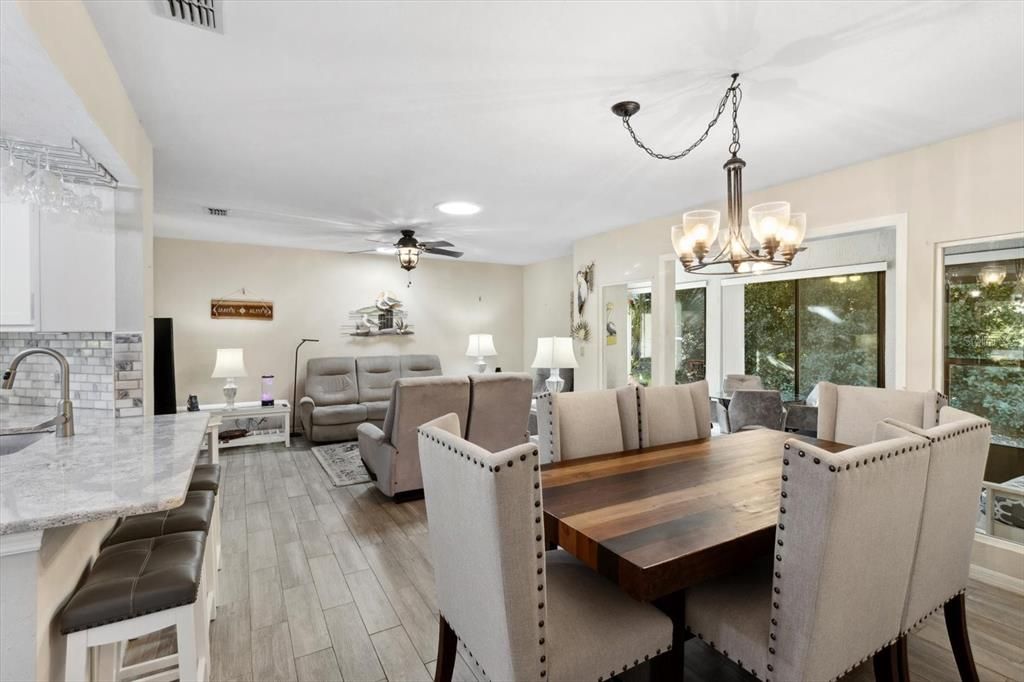 Living/Dining Room Combo w/ Neutral Colors & Porcelain Plank Tile Throughout