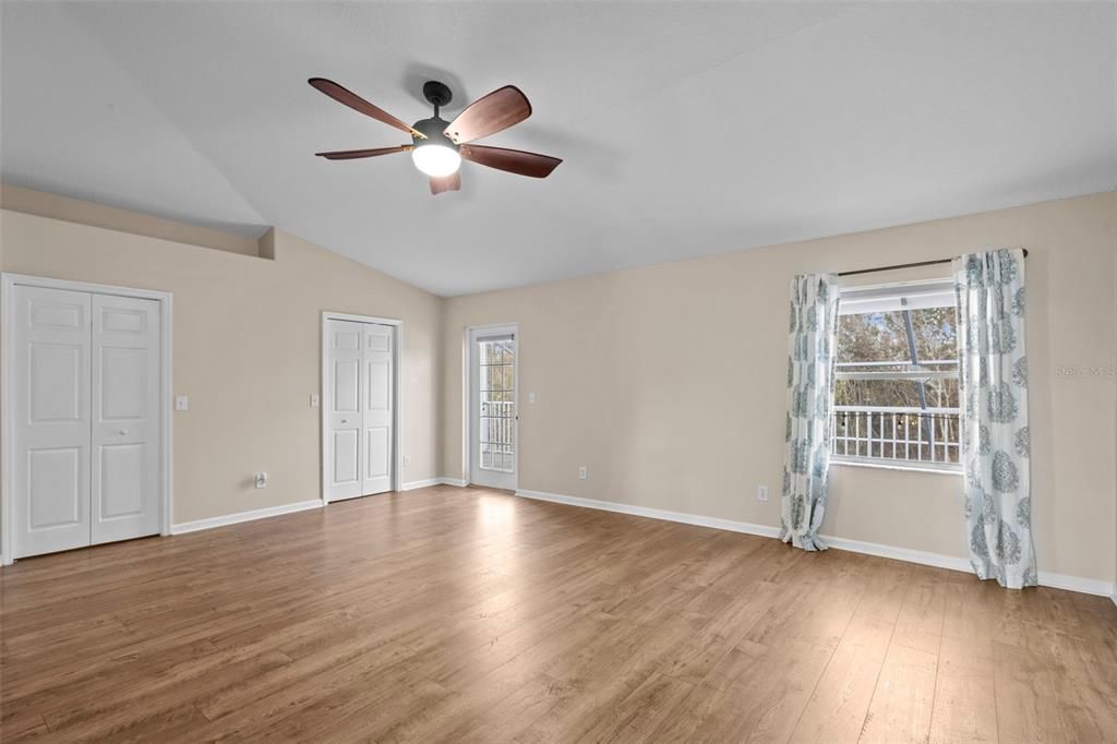 Primary Bedroom with En-Suite, Dual Walk-In Closets, and Second Story Balcony Access.