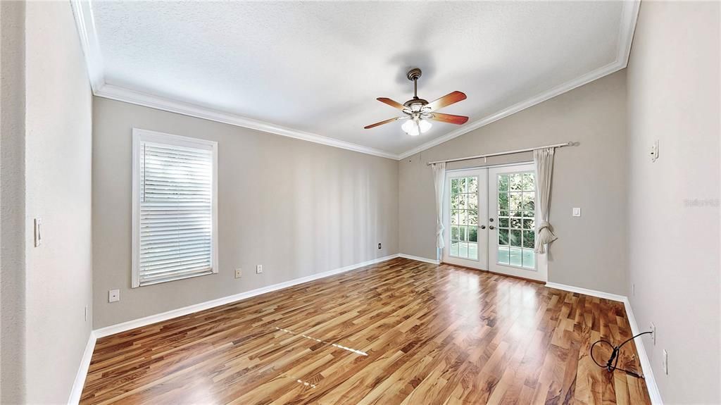 Primary Suite with private entrance via French Doors to Lanai