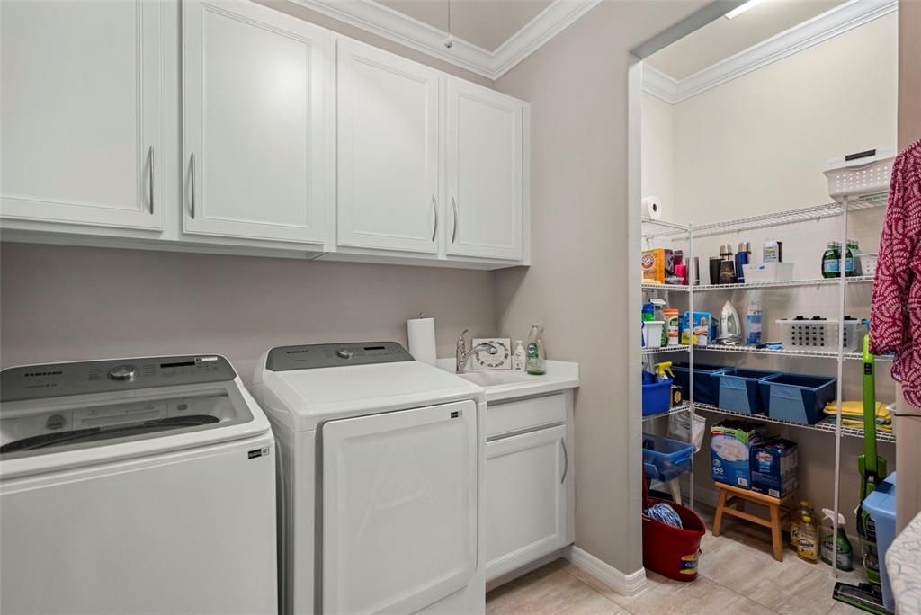 laundry room with storage closet