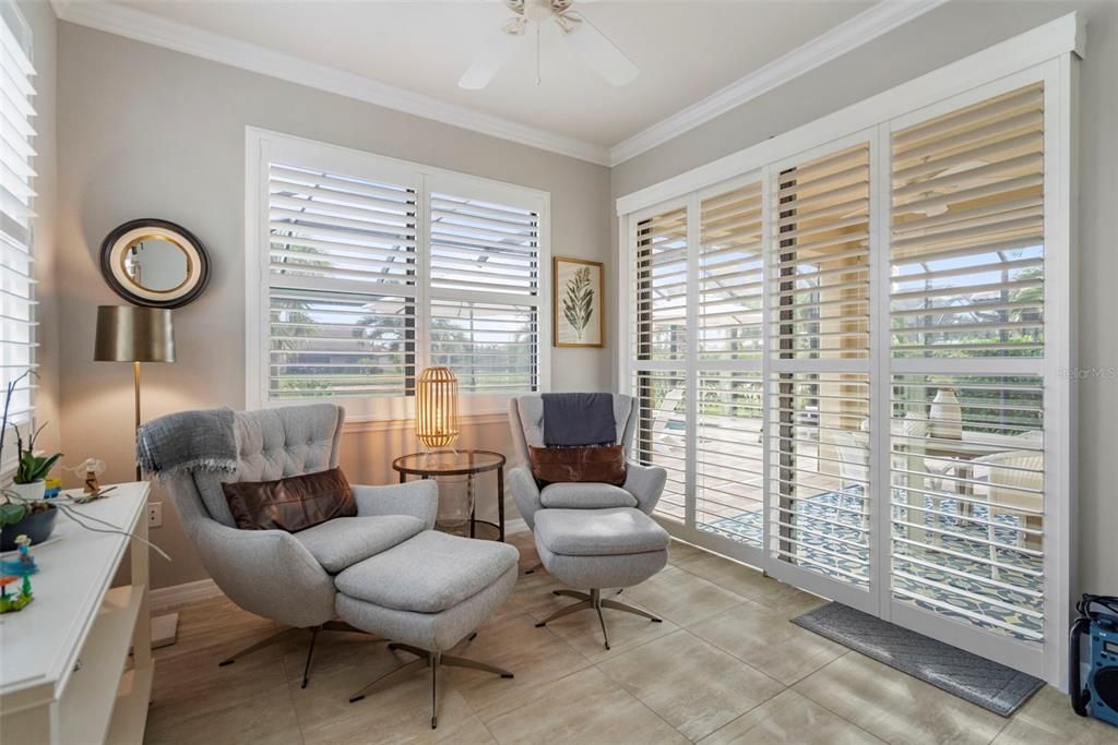 Florida room, sliding plantation shutters