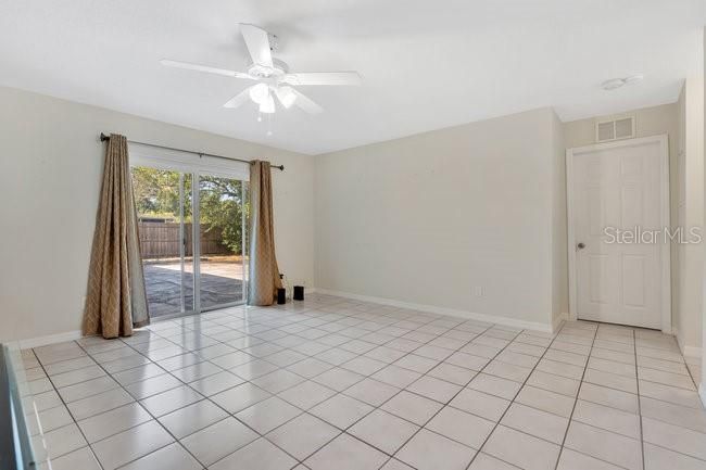 Family room has sliding doors to the patio and oversized backyard