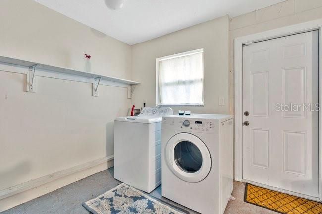 Laundry Area with additional shelving for storage