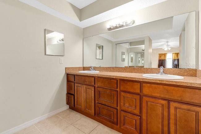 Primary Bathroom has double sinks and great storage space. Toilet and shower area is enclosed for privacy.