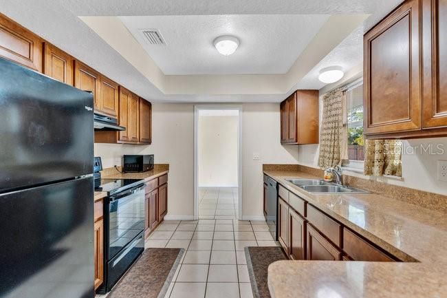 Kitchen is located between the Dining Room and Family room