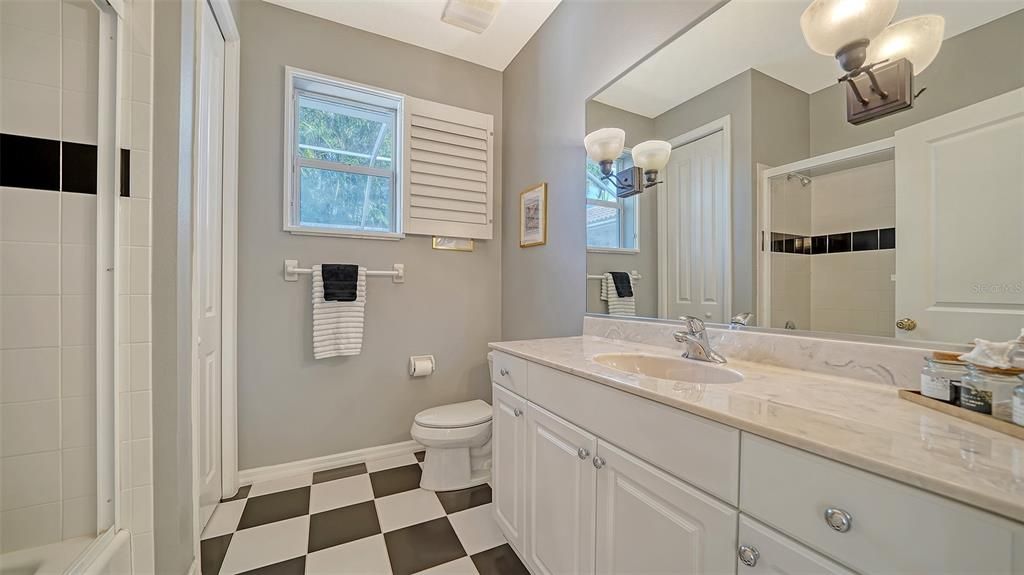 Lots of counter space and storage in the second bath and an ideal shower/ tub combination