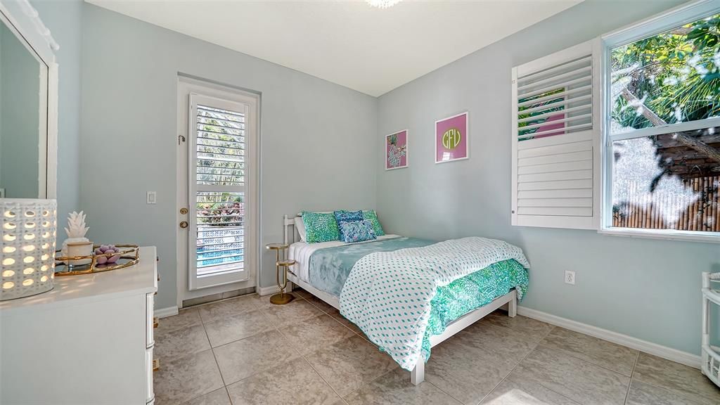 Second bedroom features a large walk in closet and direct access to the screened lanai