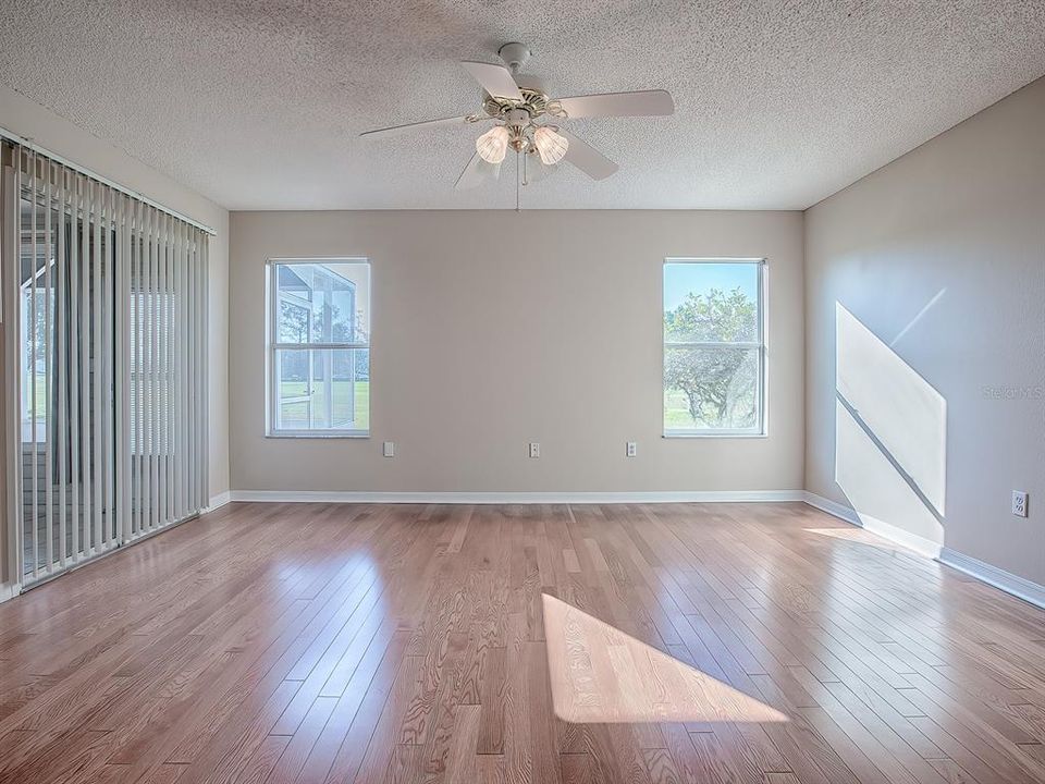 SPACIOUS MASTER BEDROOM WITH GORGEOUS FLOORING AND A GOLF FRONT VIEW!