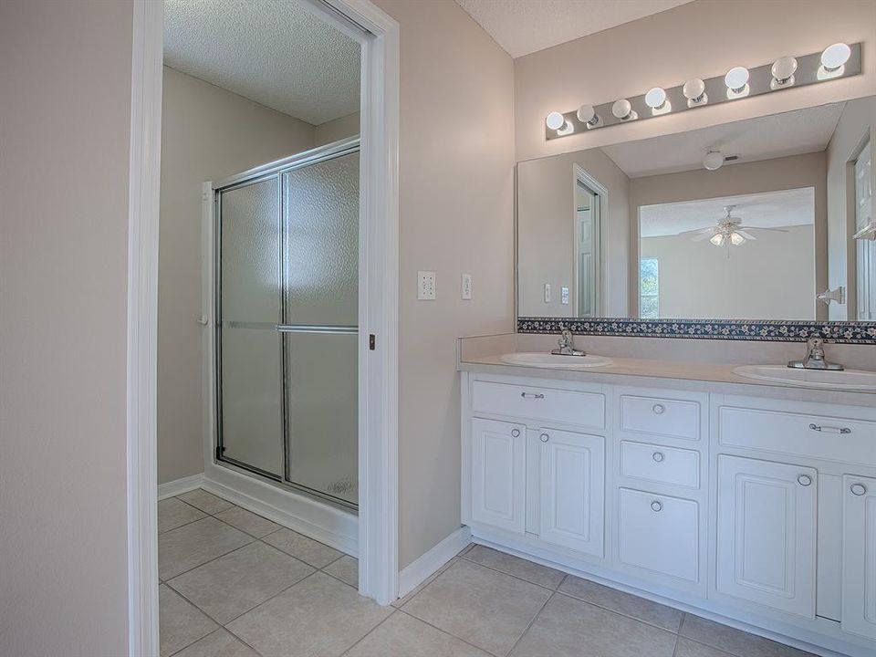 SEPERATE WATER CLOSET ROOM WITH A SLIDING POCKET DOOR FOR PRIVACY