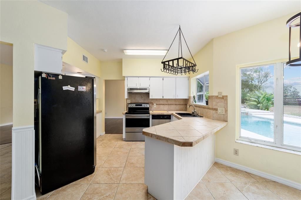 Breakfast nook and kitchen bar.