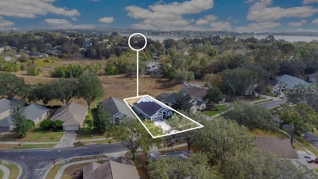 Aerial view of the home and retention pond