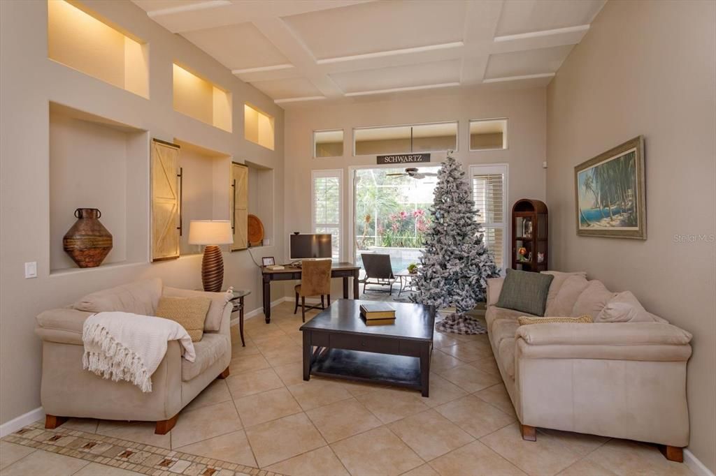 Formal living room with Frnech doors to the lanai