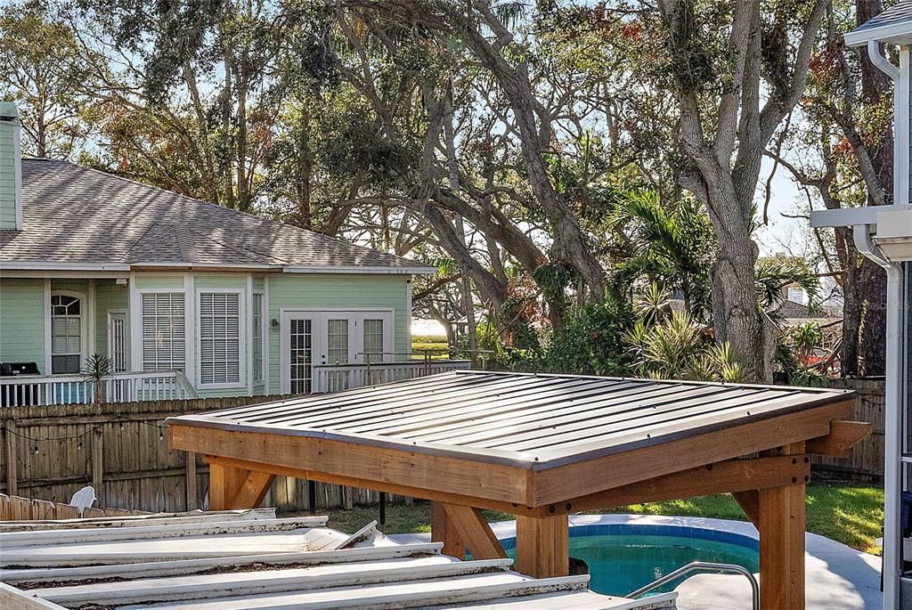 Peek a boo look of intracoastal through the trees from the deck